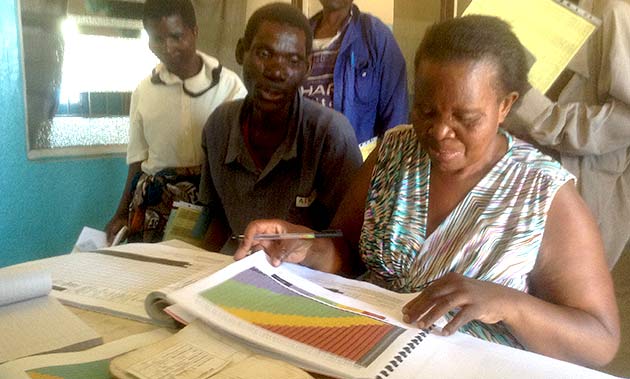 A nurse at Phalula Health Centre assesses a client’s nutritional status.