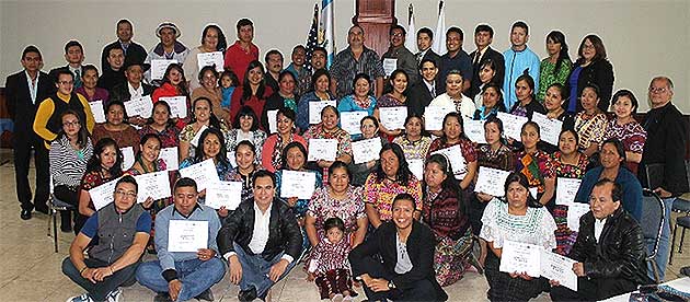 Course participants gather to receive certificates.