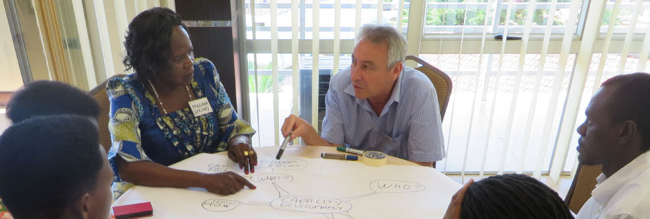 group of people at a table collaborating and discussing