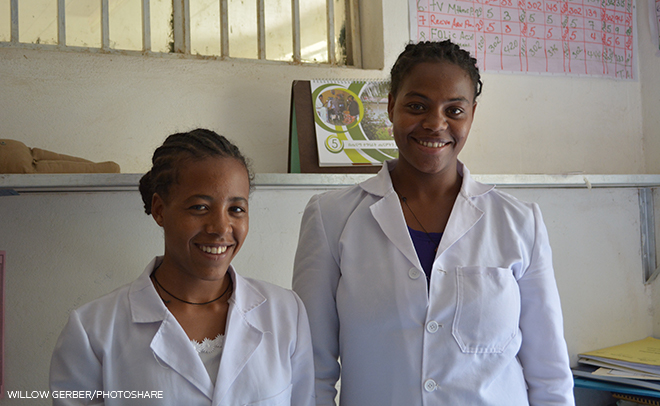 photo of two smiling health workers
