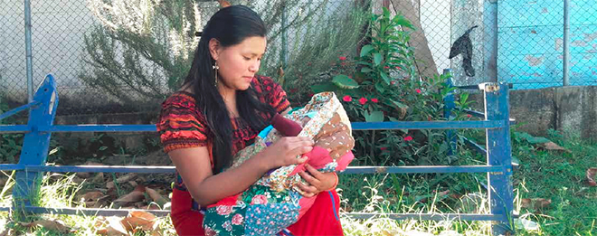 mother holding baby