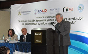 Man speaks at a podium