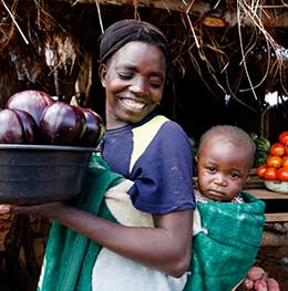© 2010 Jessica Scranton, FHI 360. Mother and child in a market in Zambia.