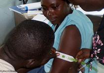 woman having her arm measured at a clinic