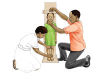 two adults measure a child's height
