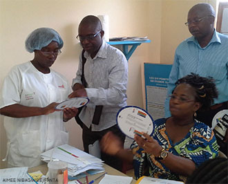 Health workers using new BMI wheels. (Photo by Aimee Nibagwire)