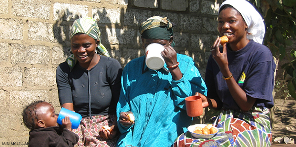 three women and a baby eating