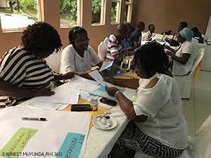 people working together along a table